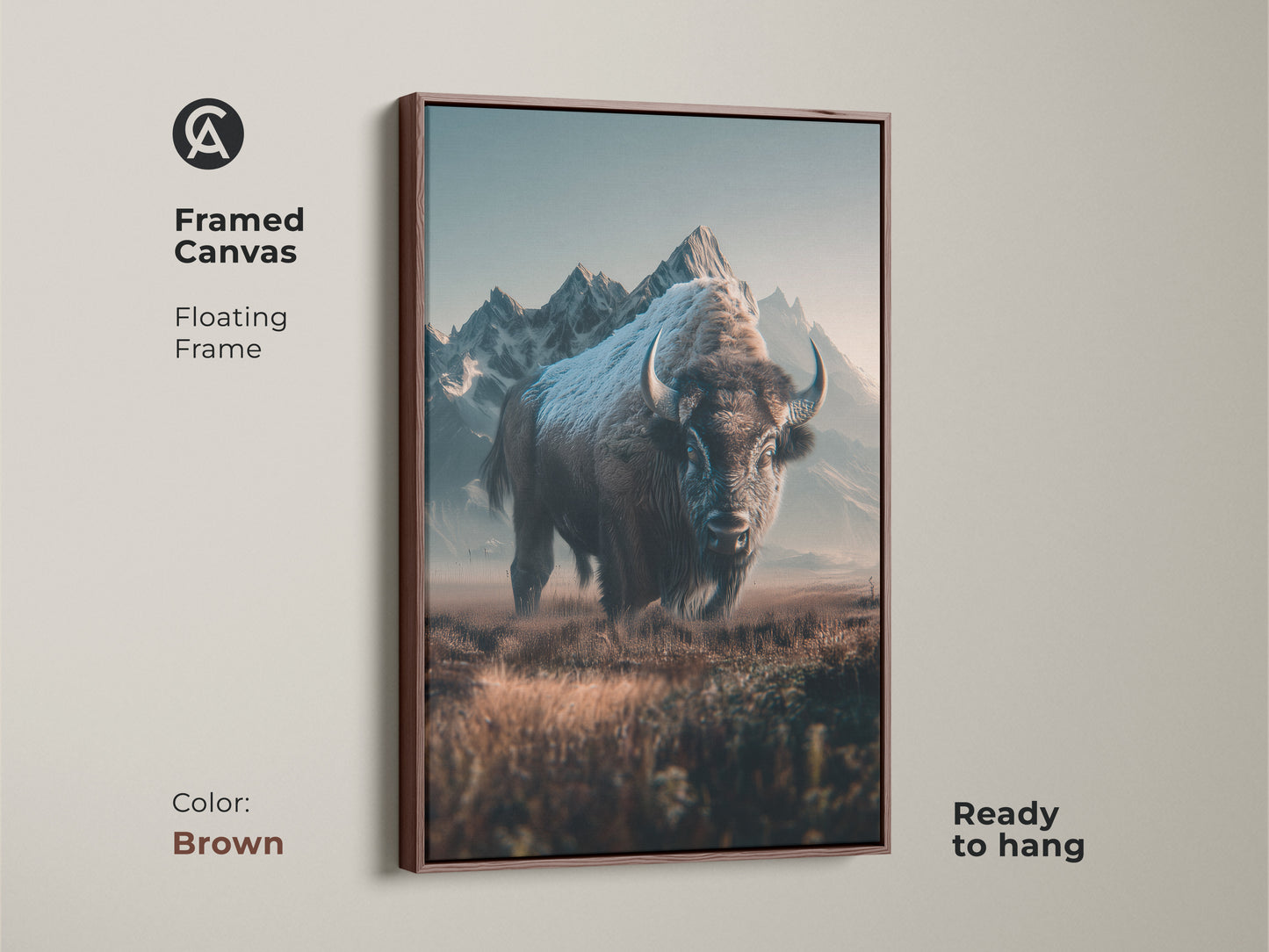 Framed canvas art featuring a bison with mountains in the background. The floating frame adds a touch of sophistication. This brown-framed canvas is ready to hang and enhances any room's ambiance.