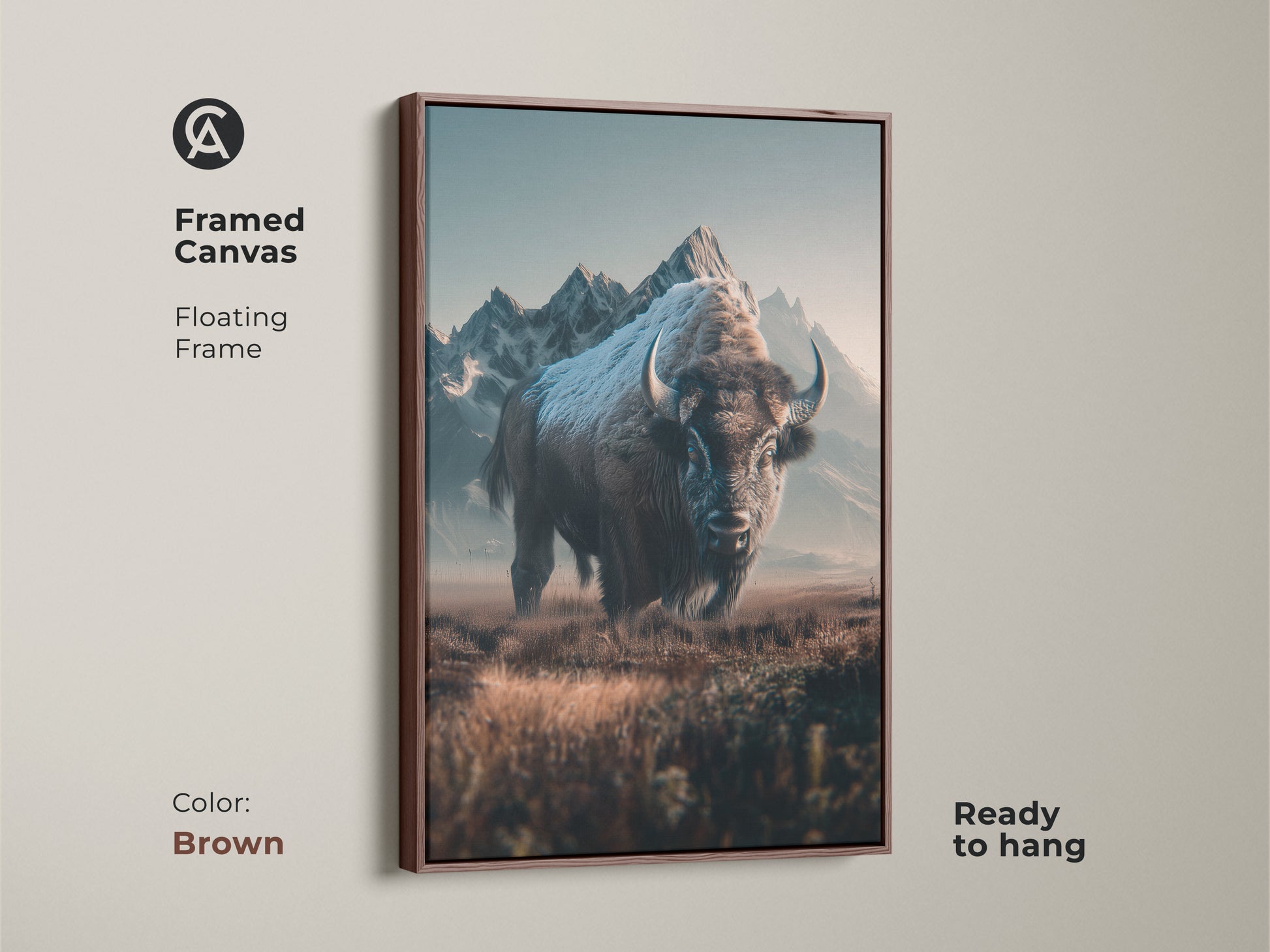 Framed canvas art featuring a bison with mountains in the background. The floating frame adds a touch of sophistication. This brown-framed canvas is ready to hang and enhances any room's ambiance.