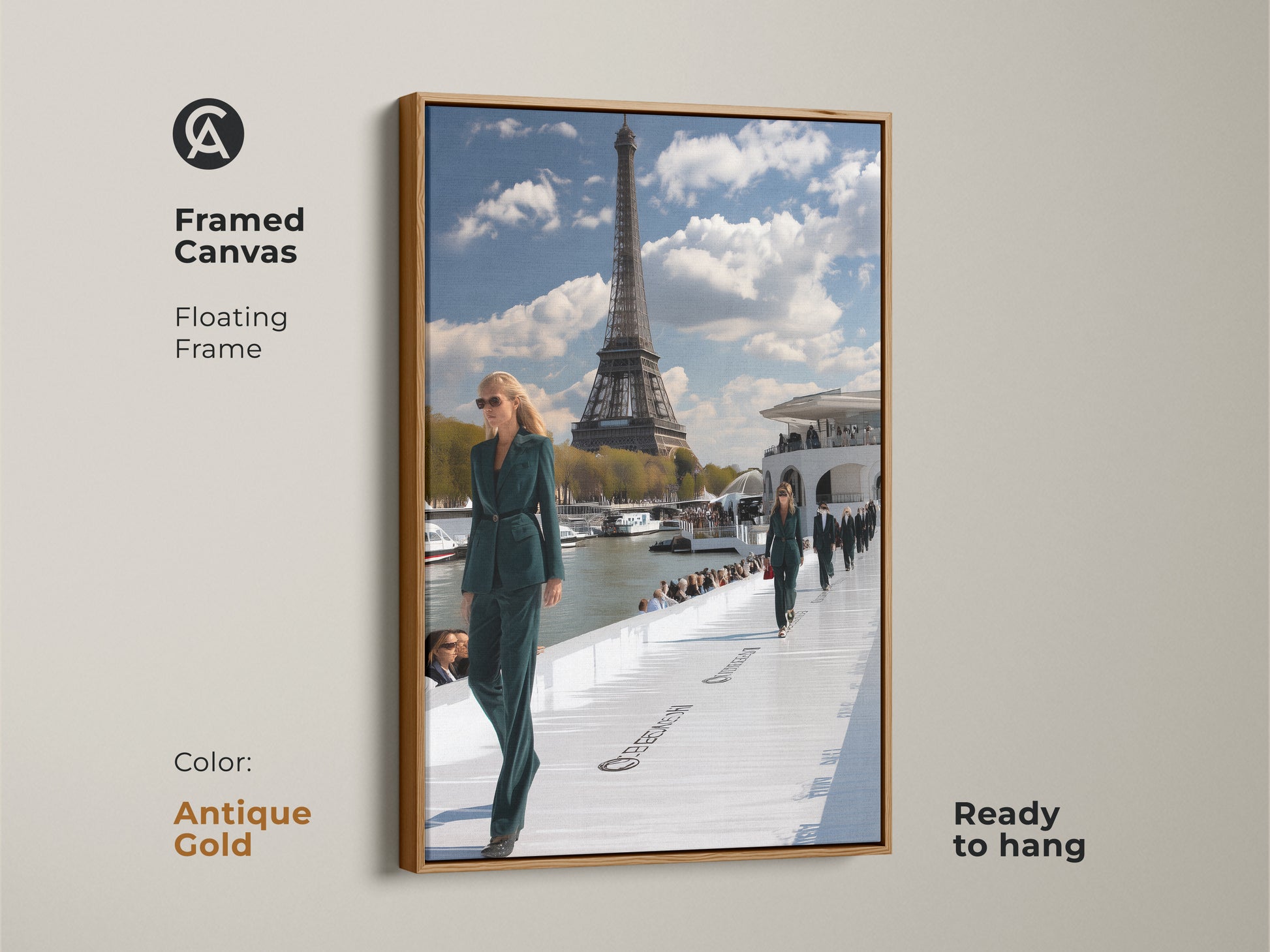 Framed canvas print of a Parisian runway show with an antique gold floating frame. The artwork displays models in teal green outfits with the Eiffel Tower in the distance. This contemporary ready to hang piece brings a touch of glamour to any space. Ideal for fashion and Paris enthusiasts.