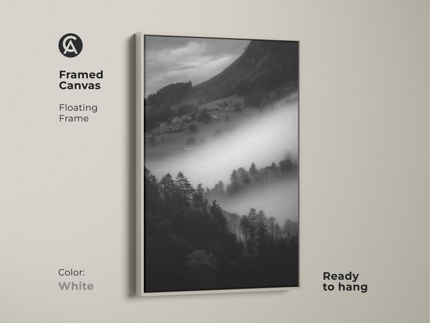 White framed canvas art of a monochrome mountain landscape. The foggy village print is black and white. Contemporary wall decor is ready to hang. The minimalist home art has a floating frame adding to its serene nature art.