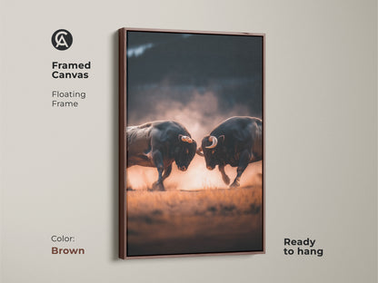 Framed canvas artwork of two bulls fighting in a brown floating frame. Ready to hang this piece adds a rustic touch. The artwork exudes power and intensity. Shop framed animal art to enhance your decor now.