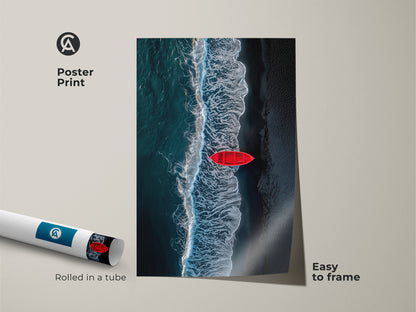 Poster print of a red rowboat on a dark sand beach. The ocean waves are crashing. The print is easy to frame. It ships rolled in a tube. This coastal artwork brings the sea to your home.