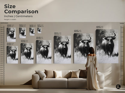 Size comparison of the buffalo charcoal sketch in inches and centimeters. View canvas and poster options. Sizes range from 16x24 to 45x67 inches. See the artwork's impact in a living room setting.