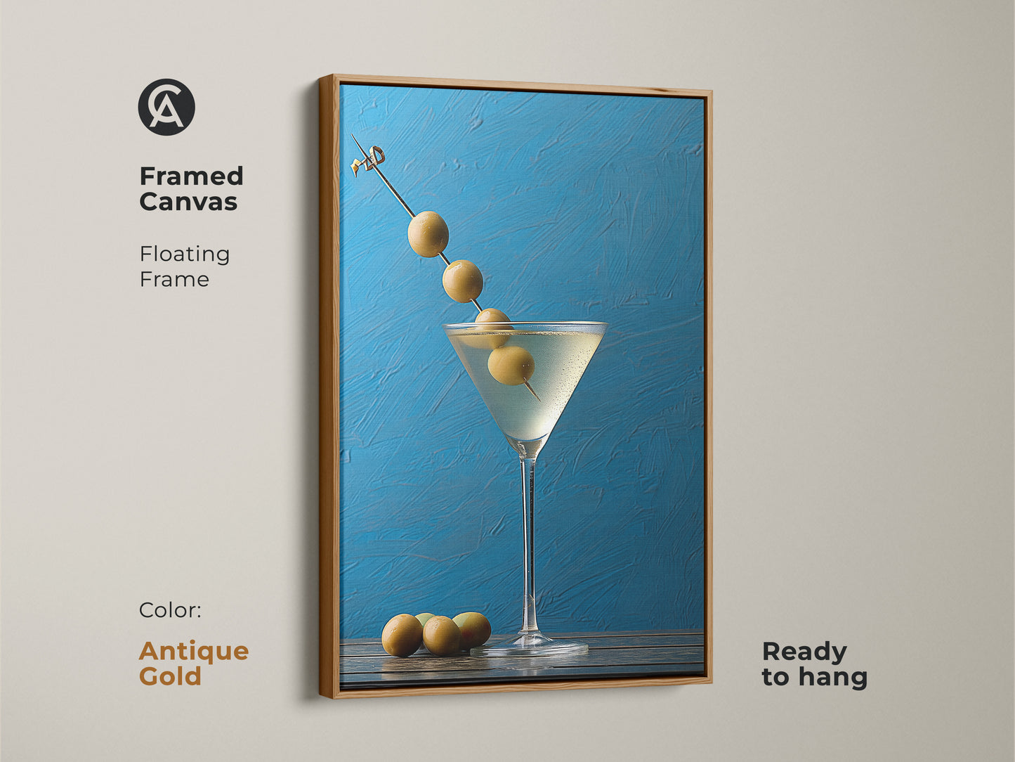 Framed canvas with an antique gold floating frame showcasing a martini art. Ideal for blue kitchen decor. This still life artwork is ready to hang. Modern bar artwork featuring an olive garnish. Azure blue background makes it a contemporary gift for home bar decoration.