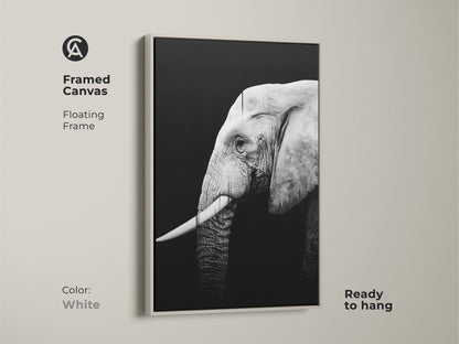 Framed canvas with a white floating frame features a monochrome elephant. This minimalist artwork is ready to hang. It is a perfect addition to modern home decor and a thoughtful gift.