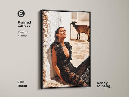 Framed Canvas with a floating black frame. The artwork is fashion photography. Features a woman in a black lace dress with a goat. This is ready to hang and brings an eclectic touch. Great for wall decor in bedrooms. Adds a distinctive touch for housewarming.