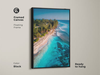 Framed canvas artwork depicting a tropical beach with turquoise waters and lush greenery. The black floating frame enhances the vibrant colors. Ready to hang this art piece brings a touch of paradise to your walls. Perfect for coastal themed decor.
