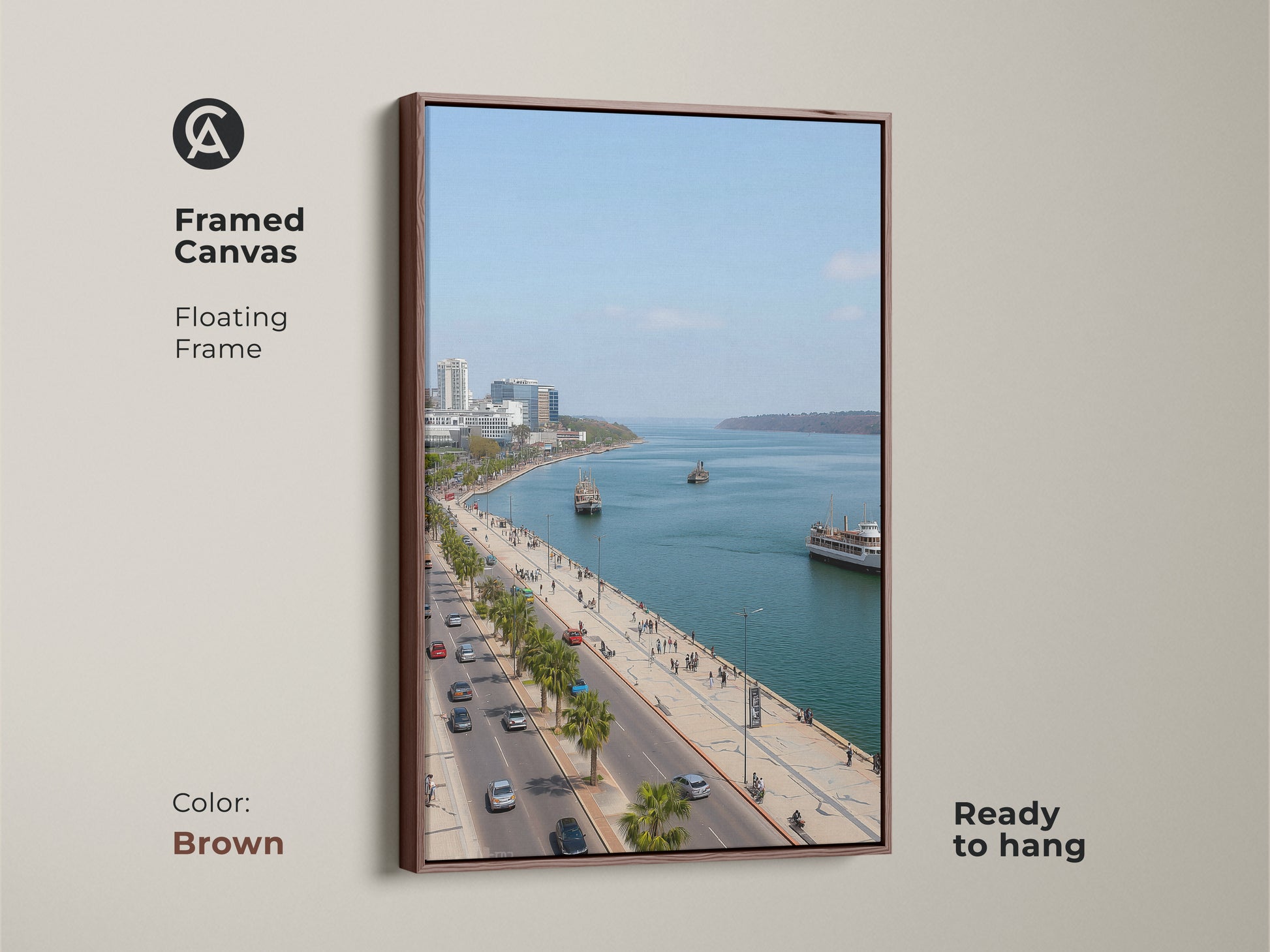Framed canvas artwork featuring a blue teal coastal cityscape. The brown floating frame enhances the travel photography. Palm trees line the street. Perfect for entry hall decor. Contemporary seaside art.