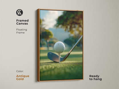 An antique gold framed canvas golf art print ready to hang. The artwork shows a golf ball on a tee ready to be hit. The background is a green golf course with trees and a hill. This framed golf art print is perfect for your home or office.