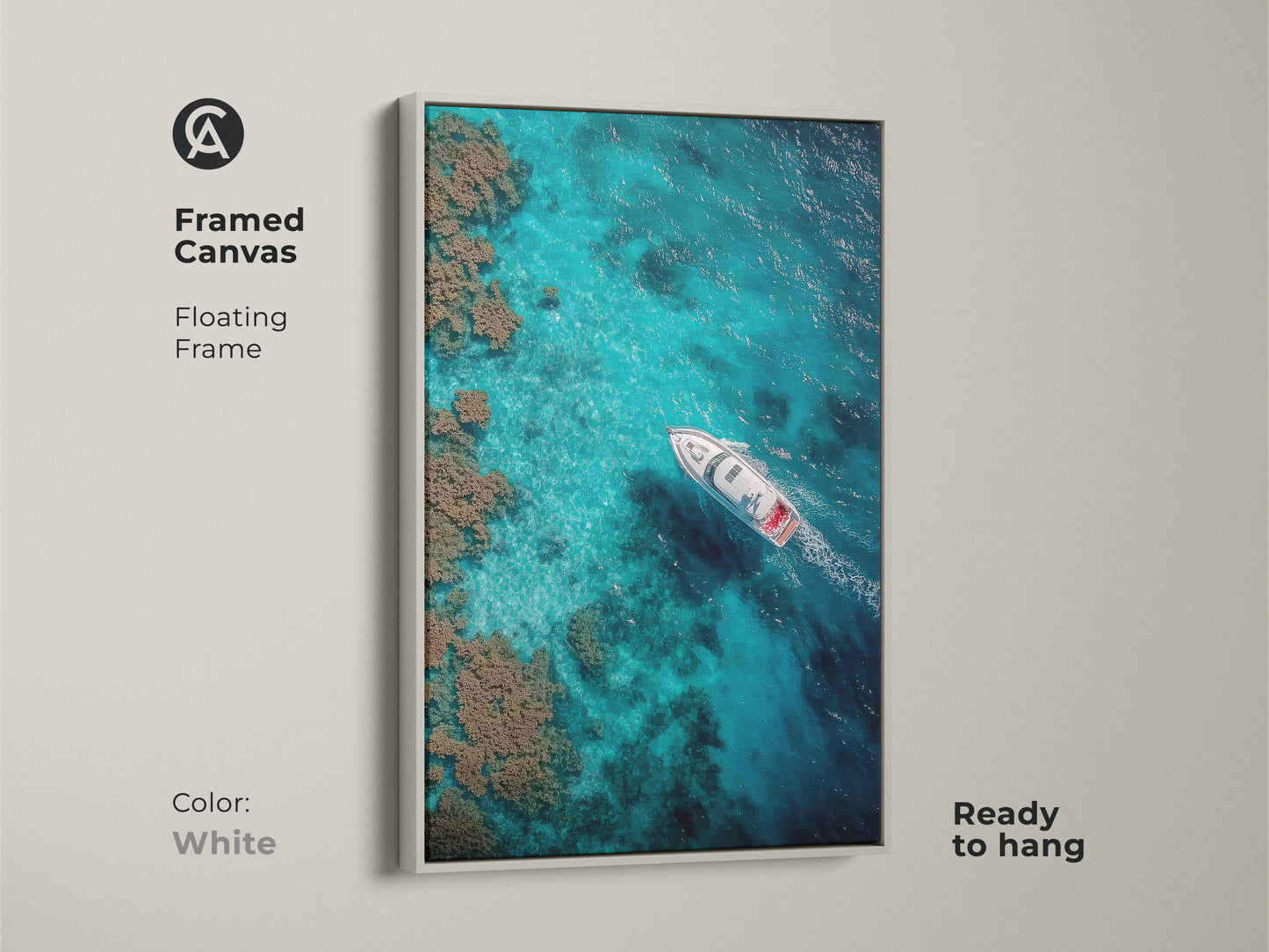 White framed canvas art. The artwork features a boat sailing on clear turquoise waters. This floating frame art piece is ready to hang. The ocean view brings a serene vibe.
