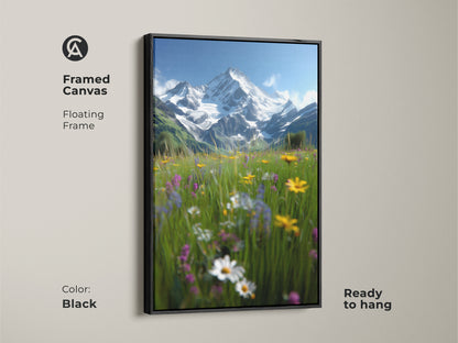 Framed canvas art showcasing an alpine meadow. The black floating frame enhances the impressionistic landscape. Snow-capped mountains rise behind wildflowers. This rustic wall decor is ready to hang. It's a perfect housewarming gift for mountain and nature enthusiasts.