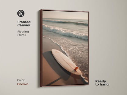 Brown framed canvas art featuring a surfboard on the beach. The warm brown frame complements the coastal scene. Ready to hang this artwork adds a cozy touch to your space. Ideal for creating a relaxing beach-themed atmosphere. Discover this beautiful brown framed art today.