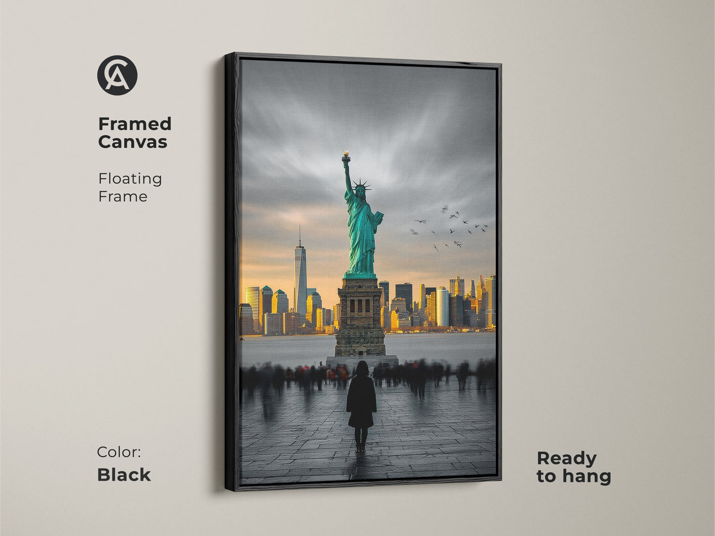 This framed canvas art shows the Statue of Liberty with the NYC skyline in the distance. The frame is a sleek black color and comes ready to hang. The art features a person looking at the statue. This floating frame canvas will elevate your home decor.