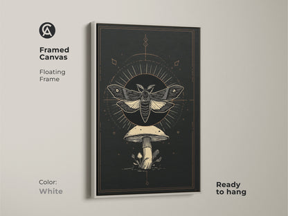 Framed canvas with a floating frame showcasing a Gothic-inspired moth and mushroom artwork. The white frame enhances the dark academia art print. It features an occult mushroom decor and celestial insect art. Ready to hang this botanical moth print adds brightness.