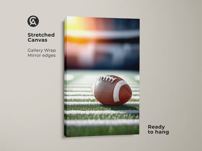 A stretched canvas featuring a realistic football on a stadium field. This gallery-wrapped art has mirror edges. It arrives ready to hang. Perfect sports fan wall decor for a man cave. It captures the essence of game day.