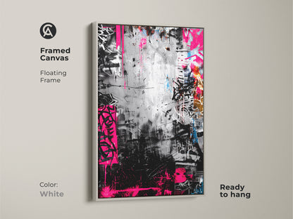 Framed canvas with a floating frame showcasing graffiti artwork in a white frame. The monochrome art is accented by bold pink. Ready to hang adding a touch of urban sophistication to any room.