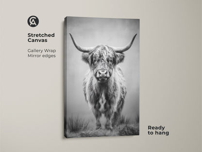 Stretched canvas monochrome bull print adds farmhouse style to your walls. This black and white highland cow art is ready to hang. A gallery wrap with mirror edges completes this wildlife wall decor.