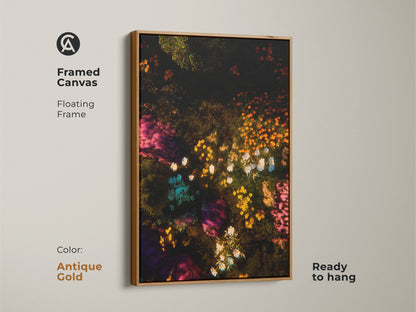 Framed canvas with an antique gold floating frame showcasing floral artwork. The art features a dark background with colorful flowers. Ready to hang this framed canvas is a great addition to your home decor collection. Its luxurious touch elevates any space.