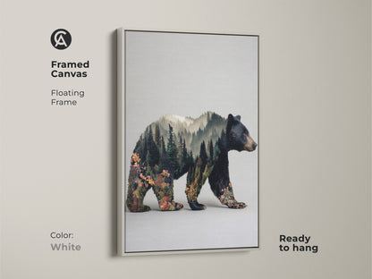 White framed canvas featuring a bear double exposure. Floating frame complements rustic modern animal art. This nature lovers gift idea is ready to hang. The forest landscape canvas print enhances any space. This is perfect for an outdoorsman gift.