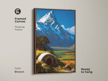 Framed canvas art featuring a Hobbit hole landscape with a snowy mountain. The brown floating frame enhances the fantasy art. This piece is ready to hang offering a cozy touch to your home. Ideal wall decor for a bedroom or living space. A unique housewarming gift.