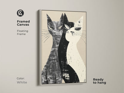Framed canvas of a Mid-Century Modern cat art with a floating frame in white. This monochrome art print features two cats in a black and white linocut style. It's a ready-to-hang stylish home art for living rooms or bedrooms.