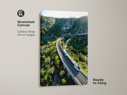 This stretched canvas features an aerial train amidst a lush green mountain landscape. The gallery wrap with mirrored edges gives a clean contemporary look. Ready to hang this artwork brings nature and transport together. This contemporary travel canvas enhances any space. Perfect as a gift for train lovers or travel enthusiasts.