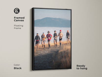 Black framed canvas featuring trail runners on a mountain path. This adventure photography art adds a touch of rustic charm. It's ready to hang and perfect for sports enthusiasts. The scenic mountain view brings the beauty of nature indoors as athletic wall decor.
