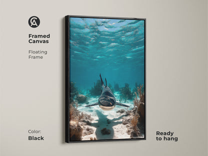 Framed canvas featuring a realistic shark in its underwater domain. The floating frame adds a touch of elegance to this marine life artwork. With its blue teal hues this coastal art is ready to hang. A perfect wall art for ocean lovers.