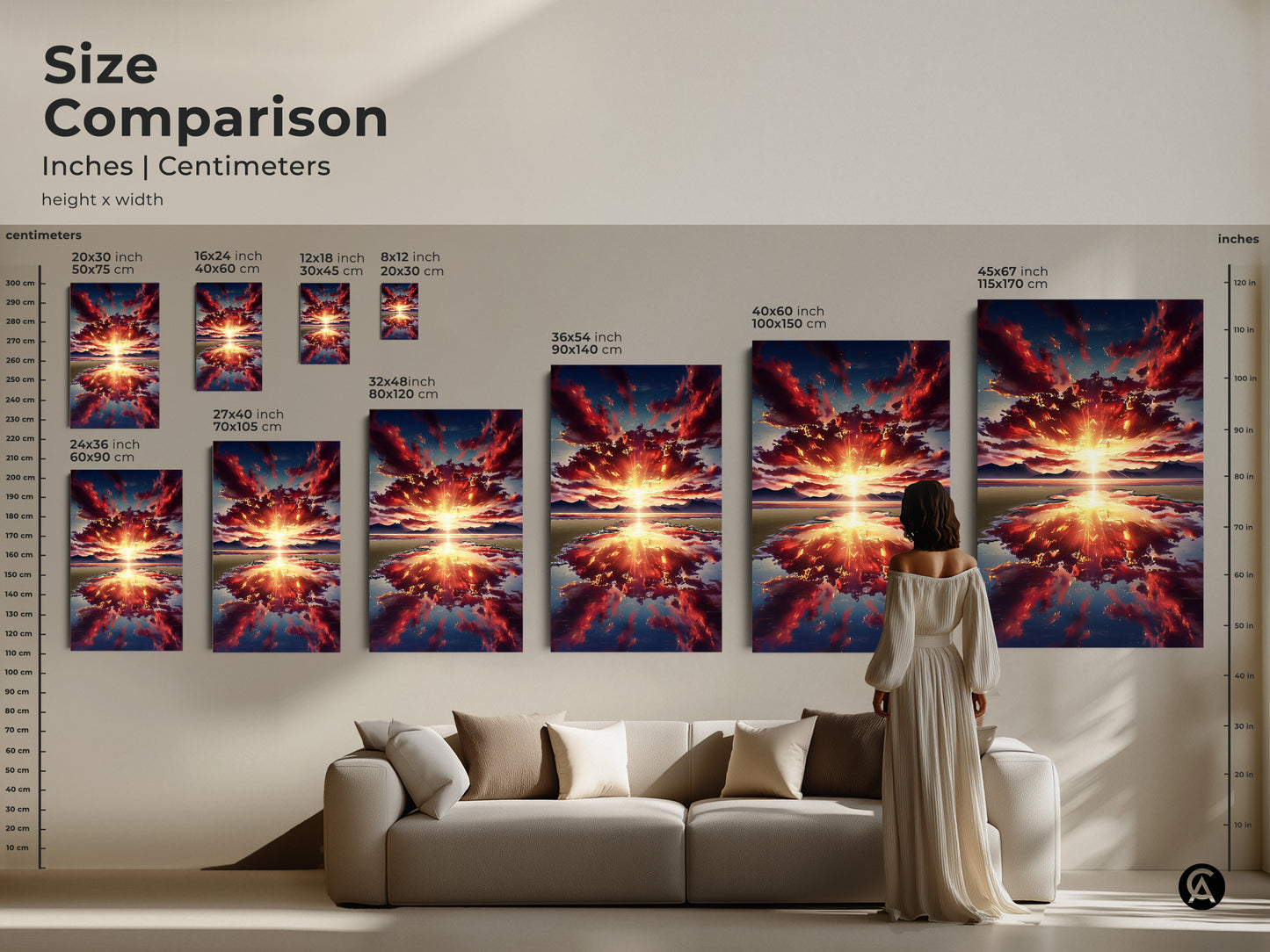 A size comparison shows various dimensions of the sunset over mountains artwork. Sizes range from small to large. It is displayed above a couch to show scale and sizing.