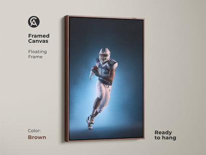 A framed canvas with floating frame features an American Football player. The contemporary teal and white sports artwork is ready to hang. The brown frame adds a modern athletic vibe. It's a fantastic gift for sports fans.
