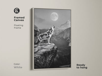 White framed canvas art displaying a wolf howling at a full moon. This floating frame accentuates the rustic wildlife wall art. Ready to hang this piece brings a touch of the wild to your home. Ideal for bedroom nature decor or as a gift for wolf lovers. The monochrome wolf canvas captures the spirit of the animal.