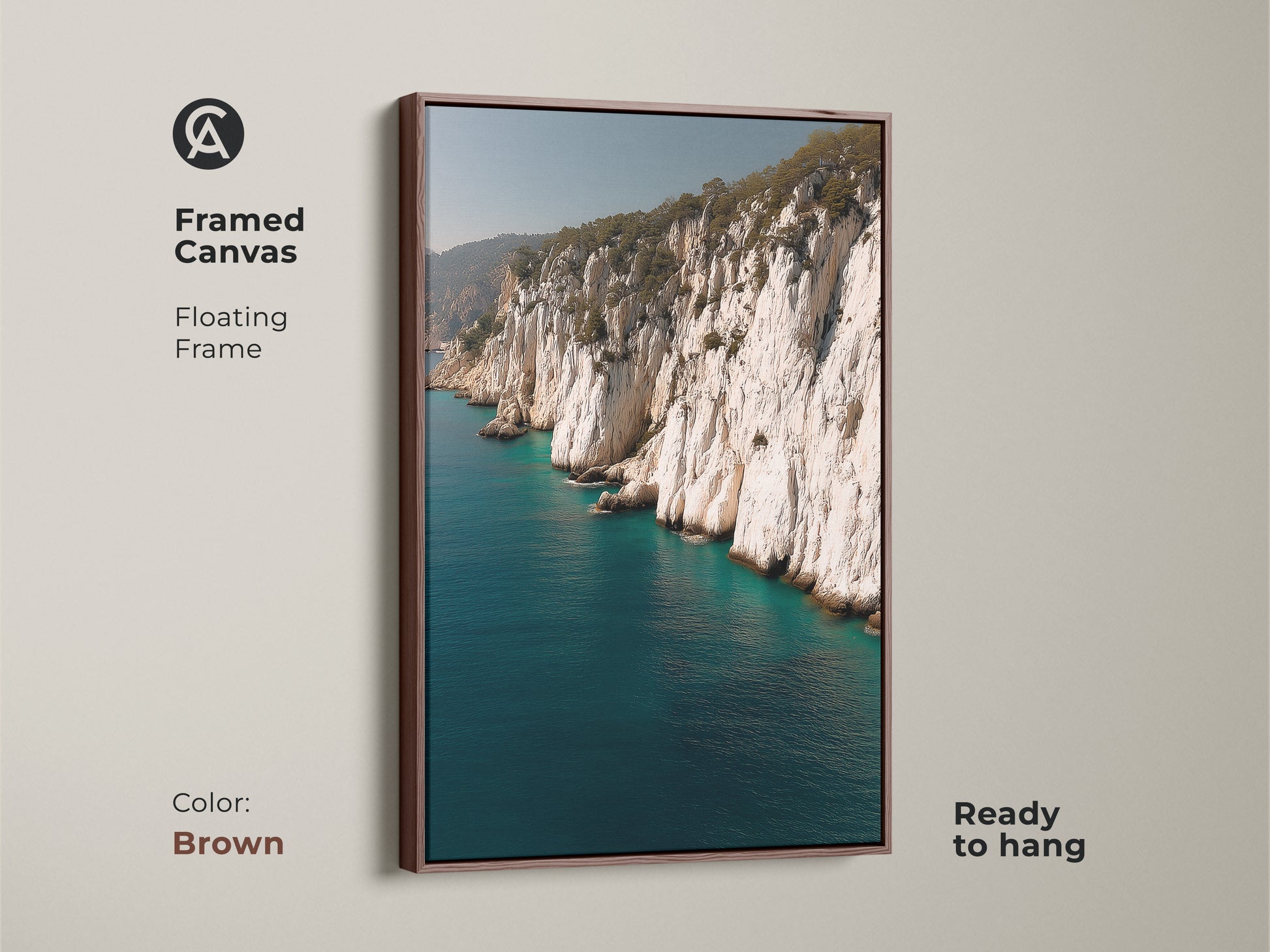 Framed canvas of ocean cliff coastal art in a brown floating frame. A beach lover gift this realistic ocean nature artwork brings seaside landscape vibes to your home decor.