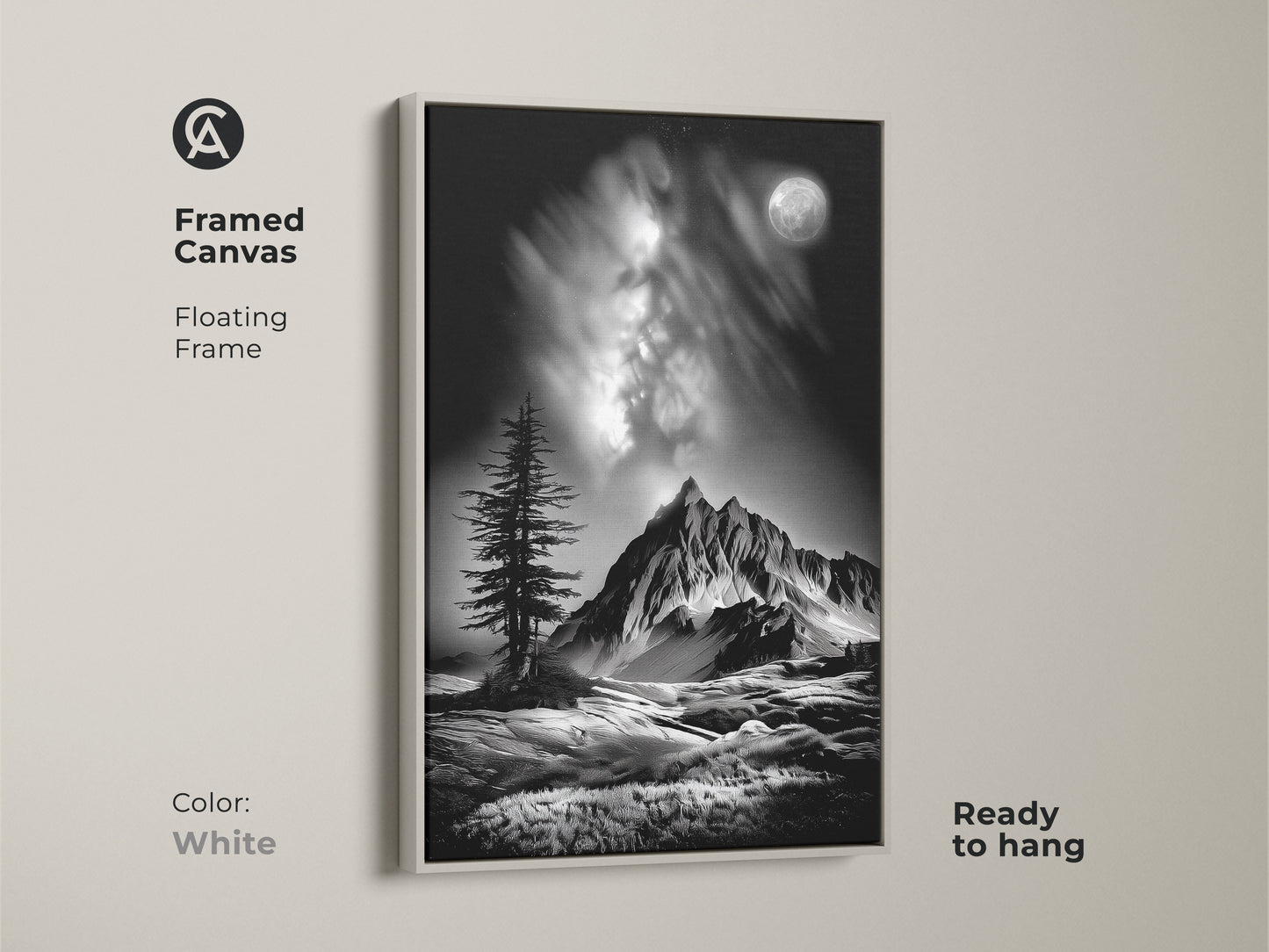 A white framed canvas features monochrome mountain art. The floating frame showcases a black and white landscape with a moonlit pine tree. This contemporary nature artwork is ready to hang.