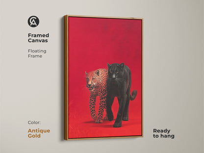Framed canvas art presents a black panther and leopard against a red backdrop. The floating frame is antique gold and ready to hang. This piece adds a touch of luxury to wildlife artwork. Transform your space with this eye-catching and sophisticated art.