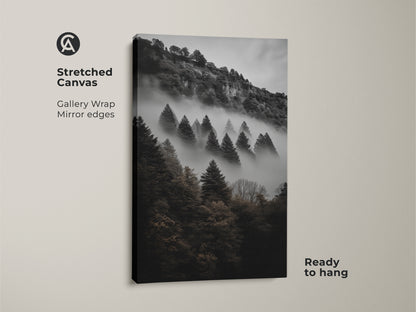 Stretched canvas art featuring a dark green forest. Gallery wrapped with mirror edges this monochrome mountain wall art shows pine trees in a foggy landscape. Ready to hang modern nature art. An atmospheric forest canvas perfect as residential wall art.
