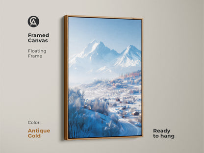 A framed canvas print showcases a winter mountain landscape. An antique gold floating frame surrounds the artwork. The art print captures snow-covered houses in a valley. This ready-to-hang piece adds elegance.