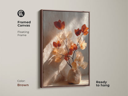 Framed canvas in brown featuring Terracotta Bougainvillea. Floating frame showcases cream and burnt orange botanical artwork. Ready to hang this boho vase still life wall art. Add organic modern elegance to your living room with this plant art.