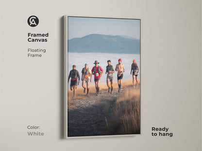 White framed canvas featuring trail runners in a mountain landscape. This adventure photography art offers a clean and modern look. Ready to hang it brings a touch of the outdoors inside. Ideal as rustic wall decor or a gift for sports enthusiasts.