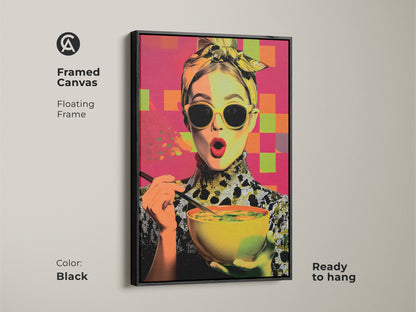 Framed canvas featuring a pop art woman enjoying soup. The floating black frame enhances this contemporary kitchen wall art. A foodie gift for her with yellow orange and pink abstract elements. This modern woman portrait is ready to hang. It's colorful kitchen decor.