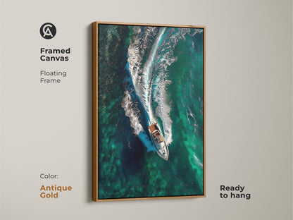 Framed canvas with an antique gold floating frame displaying emerald ocean waves and a speedboat. Ready to hang this aerial view canvas art brings a coastal feel. An ideal gift for captain or boating enthusiasts.