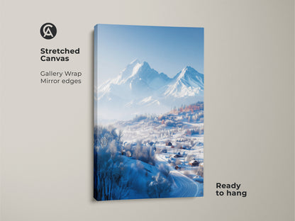 A vertical shot of a stretched canvas print. The gallery wrap showcases a winter mountain landscape. The artwork features snow-covered houses in a valley. Distant mountains complete this ready-to-hang piece.