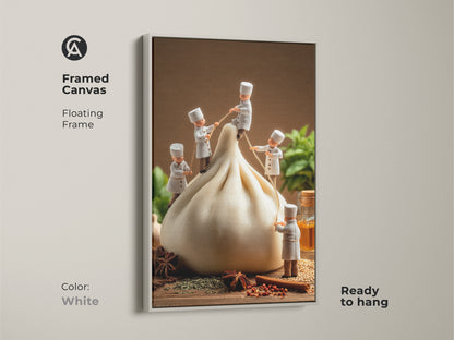 White framed canvas art print of chefs and a dumpling. The floating frame complements this playful food artwork. The print is ready to hang brightening your kitchen space. The white frame offers a clean modern look. A unique wall art piece for culinary-themed interiors.