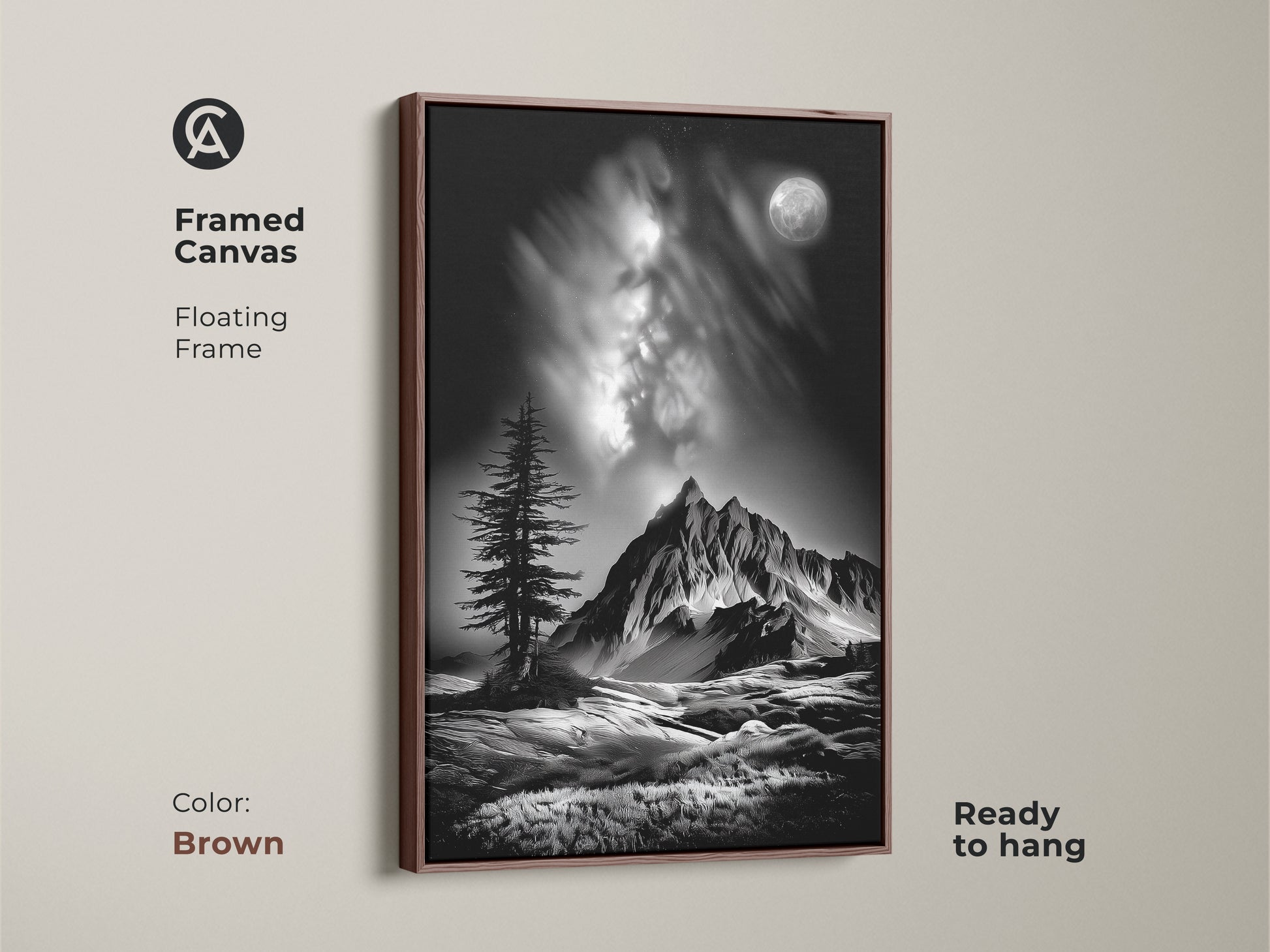 A brown framed canvas showcases monochrome mountain art. This floating frame features a black and white landscape with a moonlit pine tree. It's a ready to hang nature wall art decor piece.