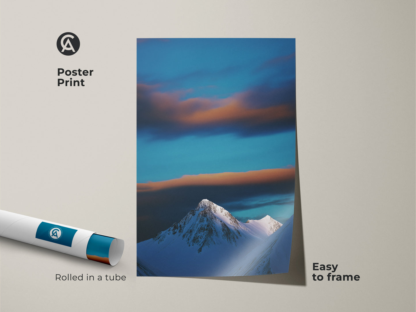 A rolled poster print displays a blue sky and clouds over a snowy mountain. This nature photography is easy to frame. Perfect as minimalist mountain art it brings tranquil winter scenery to any space. An ideal gift for outdoor lovers.