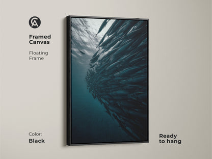 Framed canvas featuring a school of fish with a black floating frame. This underwater ocean wildlife print is ready to hang. The contemporary fish artwork adds a sophisticated touch. This deep blue gray teal wall art is perfect for modern home interior art.