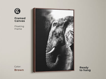 Brown framed canvas showcases monochrome elephant art. The floating frame complements this wildlife animal canvas. Ready to hang the black and white elephant print provides modern home decor. This animal lover gift wall art is timeless.