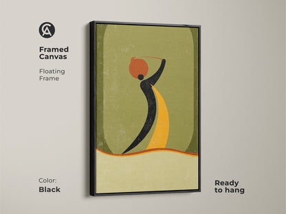 Framed canvas featuring a black floating frame with an abstract woman carrying a pot artwork. Boho wall art in a mid-century modern style. The orange yellow and green art is perfect for entryway decor.