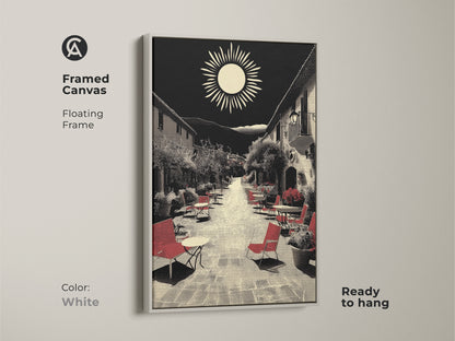 This framed canvas showcases Mediterranean village street artwork in a white floating frame. A ready-to-hang housewarming art gift featuring red seating in a retro sun landscape. Black and beige wall decor highlights this European cafe scene. Ideal for travel enthusiasts seeking wanderlust wall decor and vintage travel art.