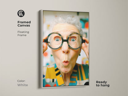 Framed canvas art with a floating frame in white. Features a woman with oversized glasses. This ready-to-hang piece adds a touch of humor and charm to your space.