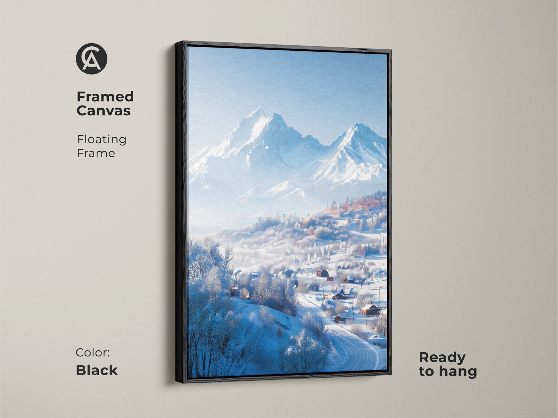 A framed canvas showcases a winter mountain landscape. A black floating frame surrounds the artwork. The print captures snow-covered houses in a valley. The serene mountain backdrop completes this ready-to-hang art.